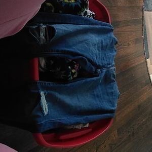 Pair of blue jeans with rips in knees